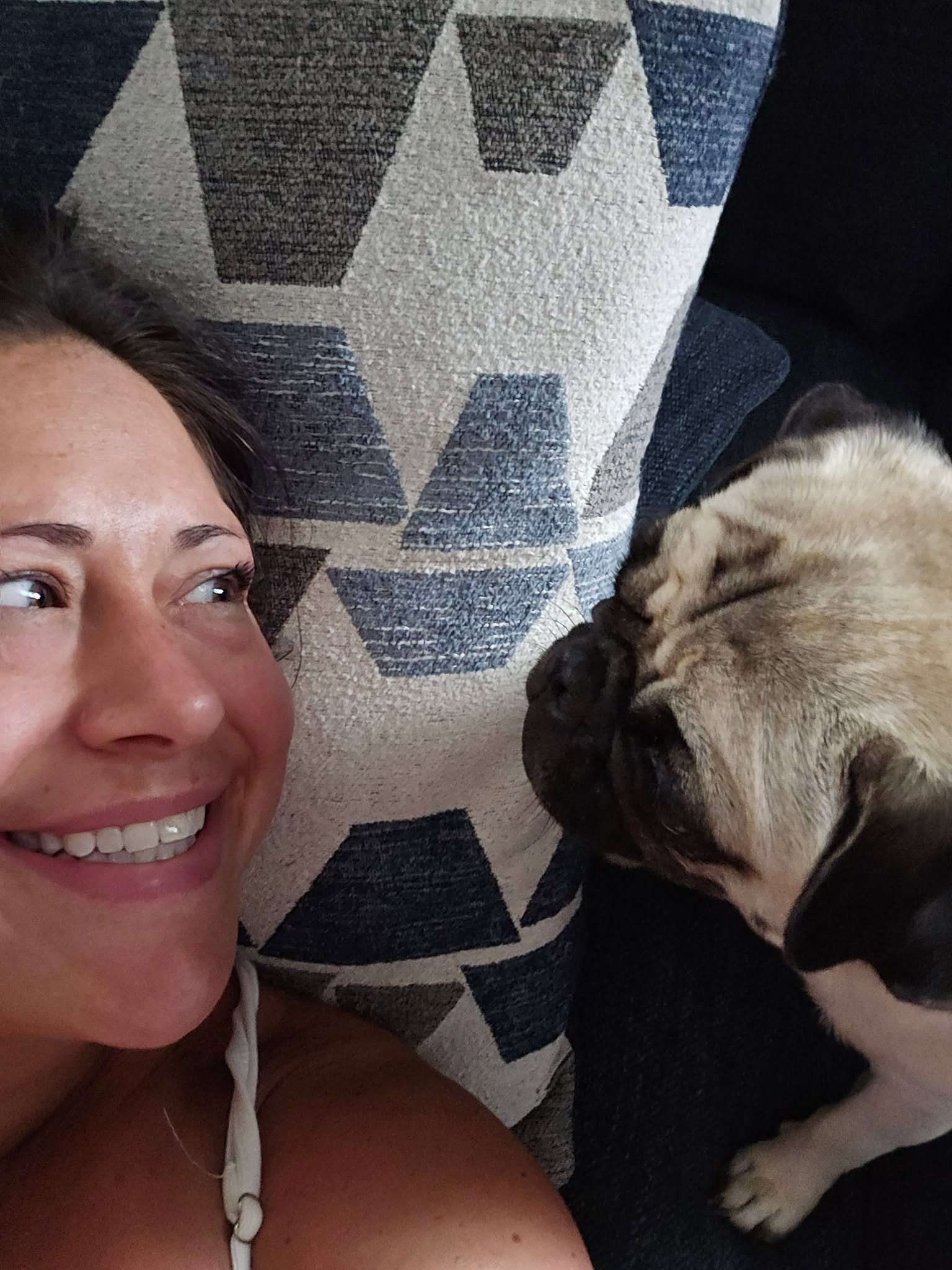 Julie with a pug leaning in